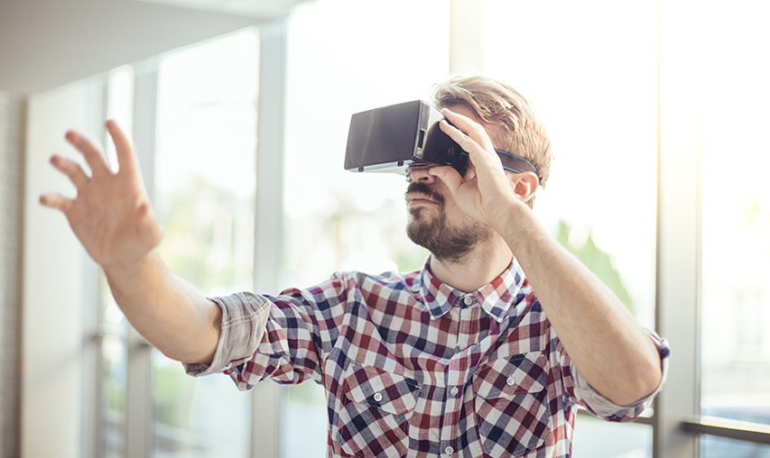 VR Technology - Young Businessman in the Office Wearing Virtual Reality VR  Headset by DC_Studio